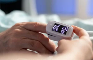 Pulse Oximeter in Pakistan device on finger showing SpO2 reading